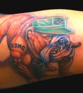 Angry dog tattoo on arm with green cap