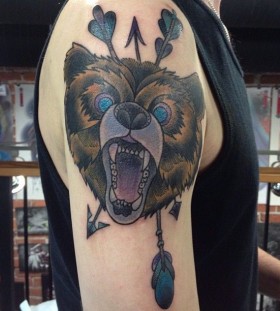 Arrow and angry bear tattoo on shoulder
