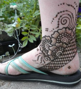Awesome black poppy tattoo on leg
