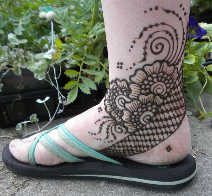 Awesome black poppy tattoo on leg