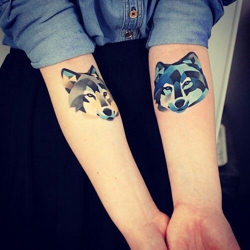 Awesome colors ornaments wolf tattoo on arm
