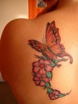 Awesome flower and butterfly tattoo on shoulder