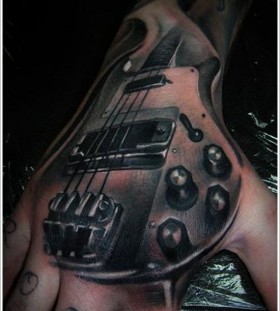 Awesome guitar ornaments tattoo