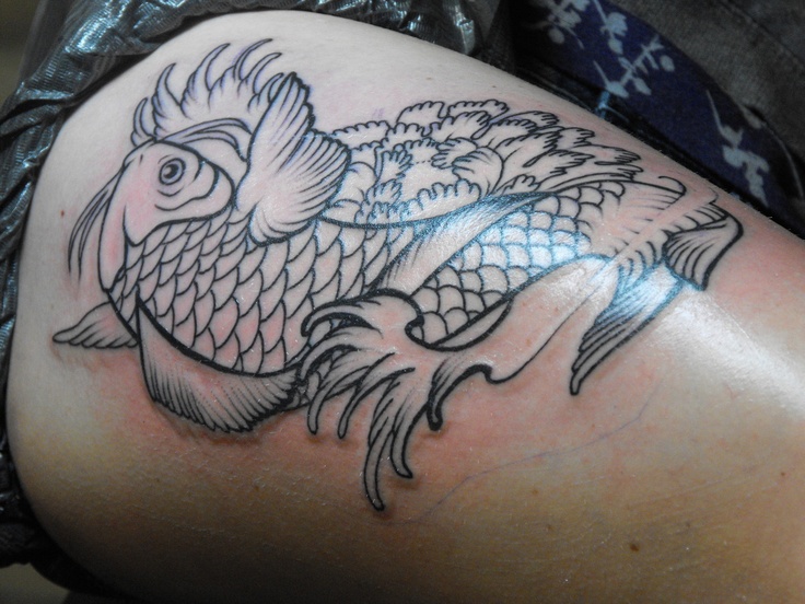 Awesome simple fish tattoo on leg