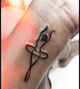 Ballerina tattoo on wrist
