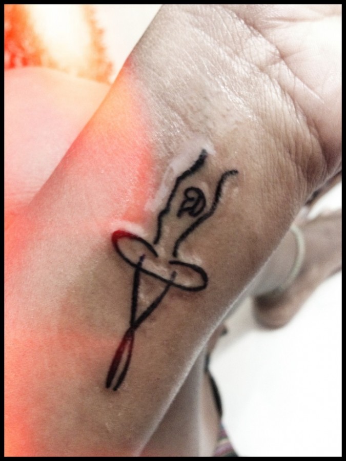 Ballerina tattoo on wrist