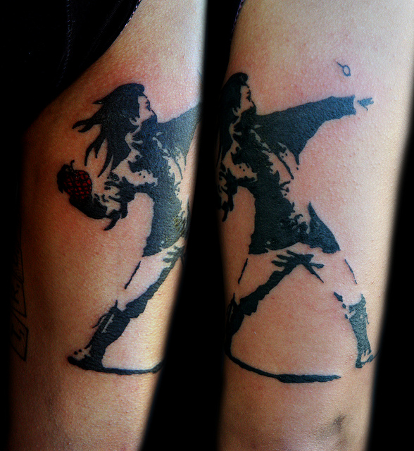 Bansky- girl with granade tattoo