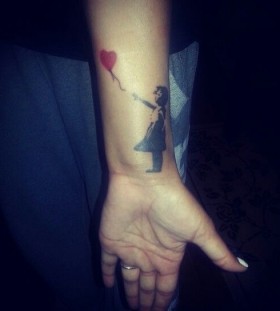 Bansky tattoo on wrist
