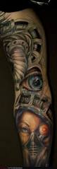 Bio mechanical style eye tattoo on leg