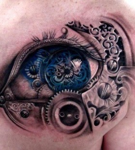 Biomechanical blue eye tattoo on shoulder