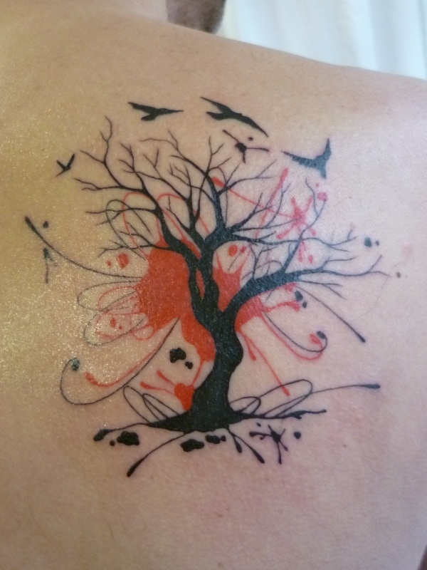 Birds and red tree tattoo on shoulder
