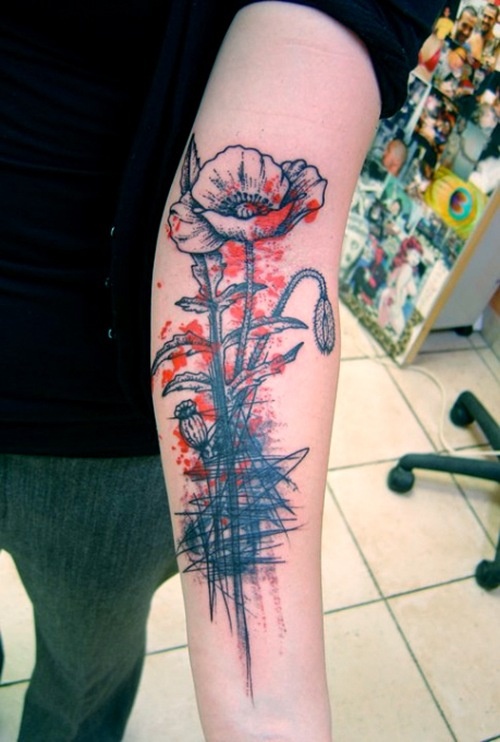 Blac and red poppy tattoo on arm