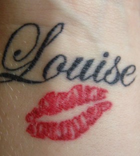 Black Louise lips tattoo on arm