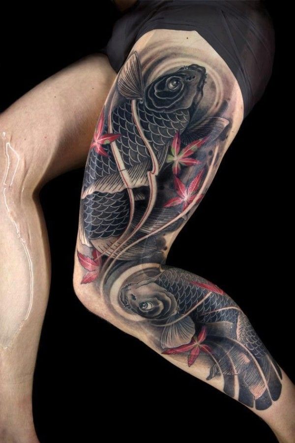 Black adorable fish tattoo on leg