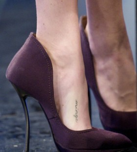 Black adorable tattoo with shoes