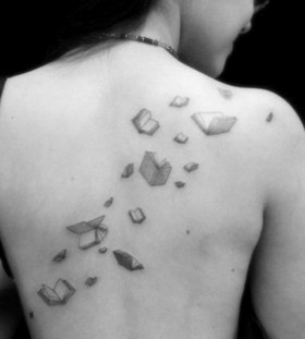 Black and white back book tattoo
