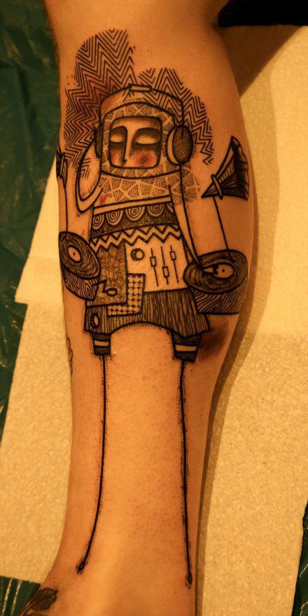 Black and white line tattoo on leg
