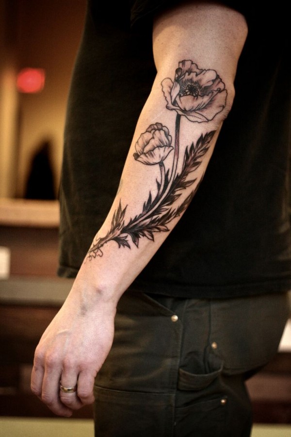 Black and white lovely poppy tattoo on arm