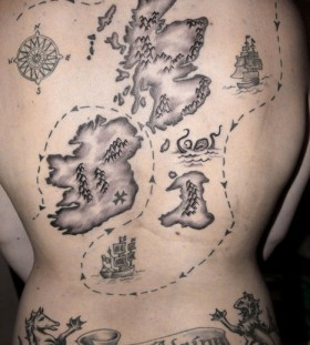 Black and white map tattoo on back
