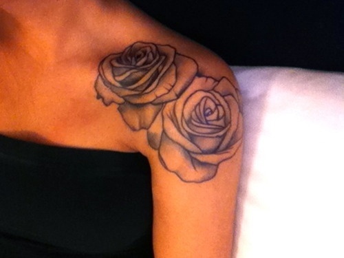 Black and white rose tattoo on shoulder