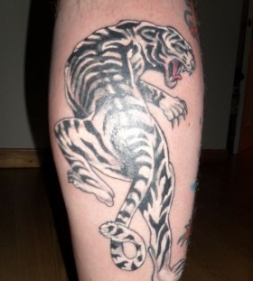 Black and white tiger tattoo on leg