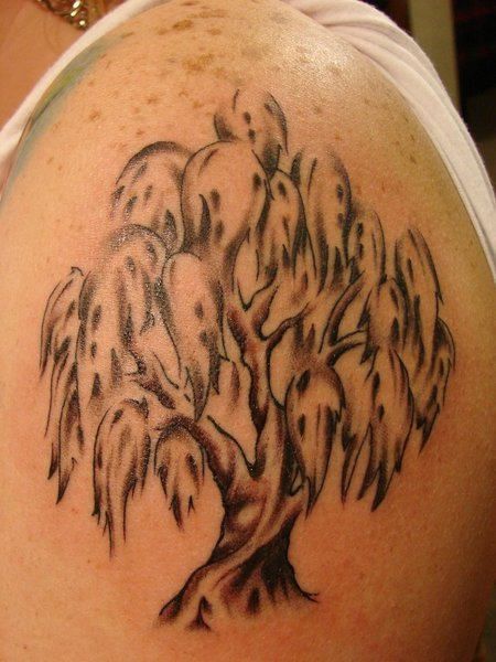Black and white tree tattoo on shoulder