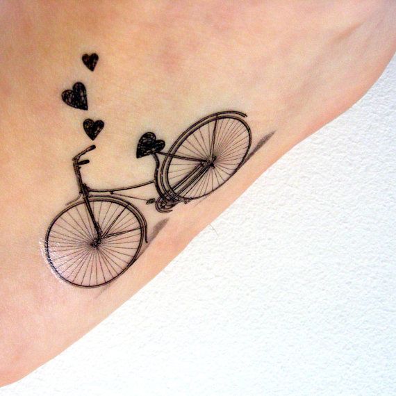 Black bicycle tattoo