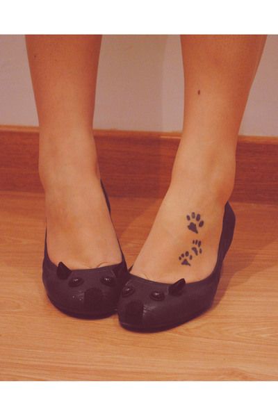 Black cat tattoo with shoes