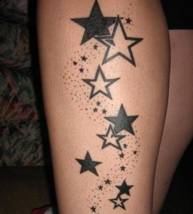 Black cool star tattoo on leg