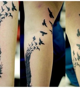Black feather and bird tattoo on leg