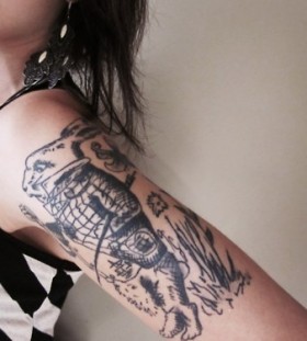 Black flowers rabbit tattoo on body