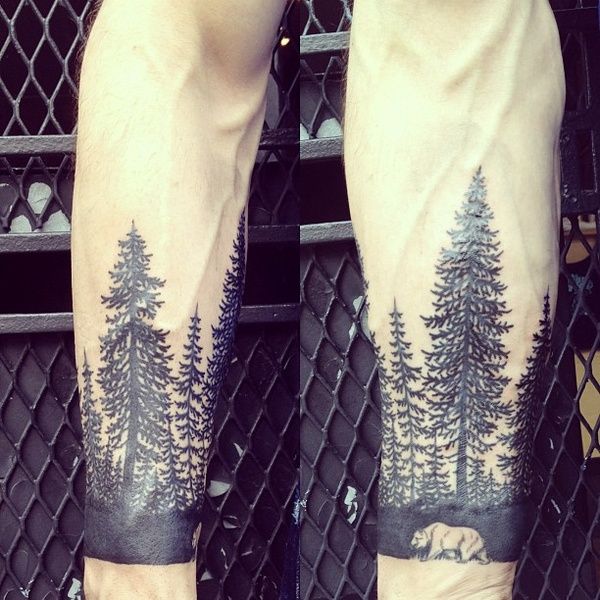 Black forests and bear tattoo on leg