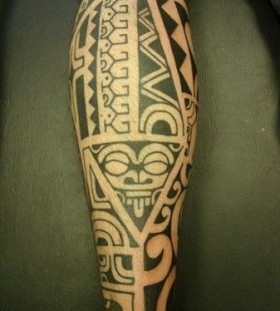 Black funny tribal tattoo on leg