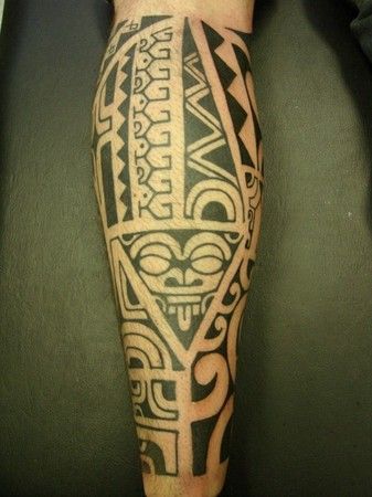 Black funny tribal tattoo on leg