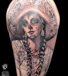 Black girl skull tattoo on shoulder