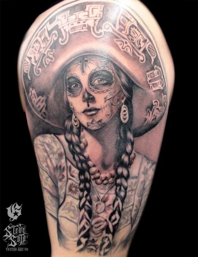 Black girl skull tattoo on shoulder