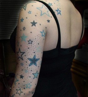 Black girls star tattoo on arm