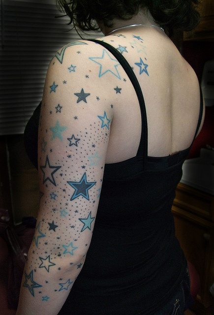 Black girls star tattoo on arm