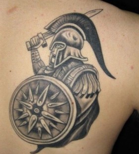 Black greek soldier tattoo on arm