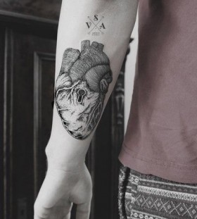 Black heart and keyhole tattoo