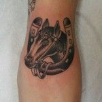 Black horse simple tattoo on arm