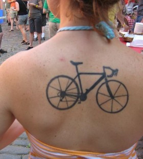 Black lovely bicycle tattoo on back