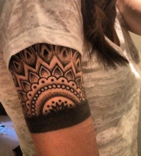 Black lovely lace tattoo on arm