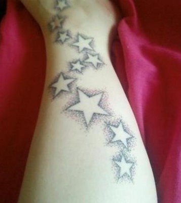 Black lovely star tattoo on arm - | TattooMagz › Tattoo Designs / Ink