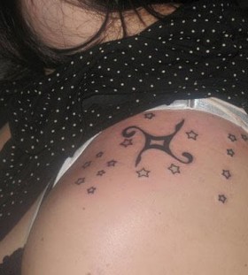 Black lovely star tattoo on shoulder