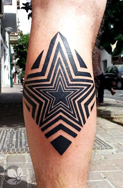 Black men star tattoo on leg