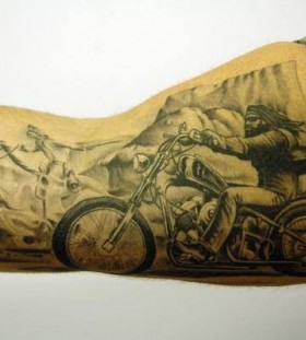 Black men's and bicycle tattoo on arm