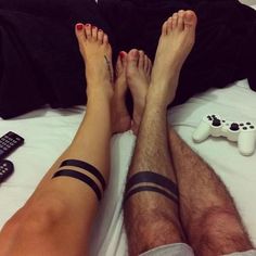 Black men's and women's lines tattoos on legs