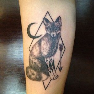 Black moon and wolf tattoo on leg