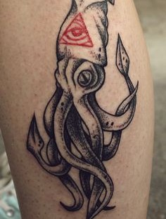 Black octopus tattoo with red triangle